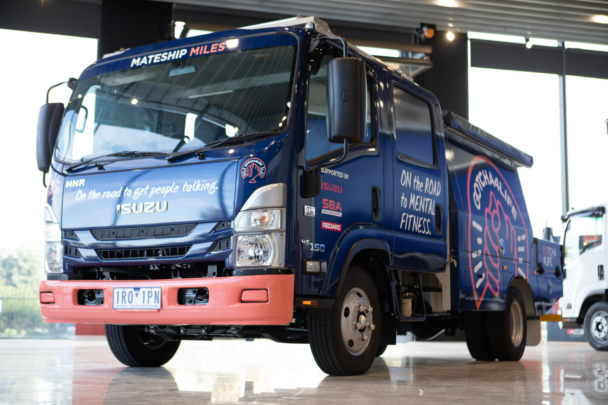 2022 Isuzu NNR 45-150 AMT Crew IFS and Custom Canopy and Accessories - Image 1