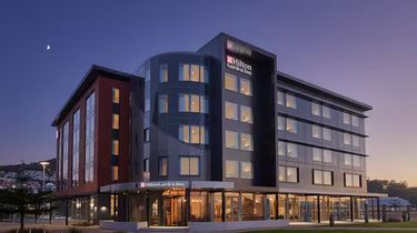 1 x Night at the Hilton Hotel Albany with Breakfast for Two, 2 x Bottles Wine, $50 Rustlers Voucher - Hero Image