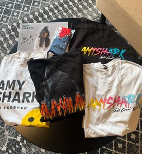 A pack of a collection of exclusive signed merchandise from Amy Shark - Hero Image