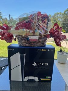 A PlayStation 5 Digital Edition, Delivering a Sleek Disc-free Gaming Experience + Hamper - Hero Image