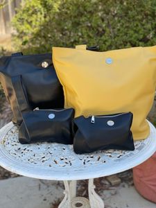 Two Leather Clutches and Two Leather Handbags from IAM - Hero Image